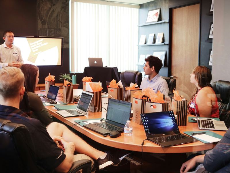 Team members attending a leadership development presentation